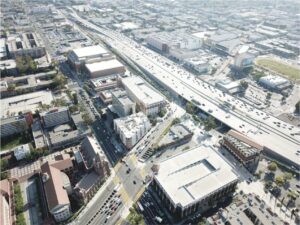 Aerial view of a city highway interchange, representing multi-state commercial insurance considerations for California and Texas contractors.