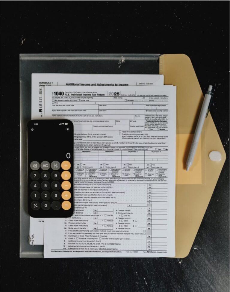 Insurance forms and a calculator on a desk, representing a contractor insurance compliance checklist.